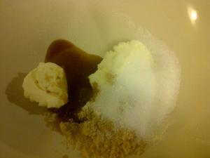 Cream together butter, white sugar, brown sugar, baking powder and vanilla extract.