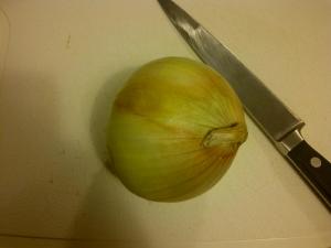 Cutting the onion.